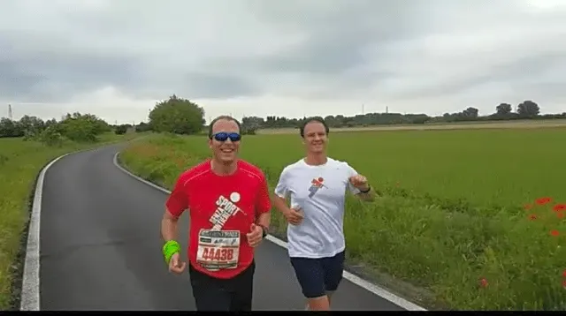 Vania and AlixPartners Lorenzo Pietromarchi running on a road through countryside during the Milan Relay Marathon